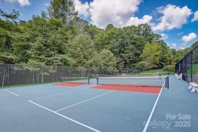 Nestled in woods of the Blue Ridge Mountains, behind protected on Wolf Laurel Country Club in North Carolina - for sale on GolfHomes.com, golf home, golf lot