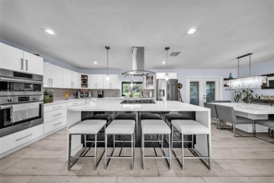 Welcome to 9480 Palmetto Club Ln E--an updated 4-bed, 2-bath on Palmetto Golf Course in Florida - for sale on GolfHomes.com, golf home, golf lot