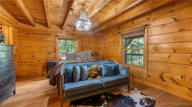Step into the charm of true log home living in the prestigious on The Club At Old Kinderhook in Missouri - for sale on GolfHomes.com, golf home, golf lot
