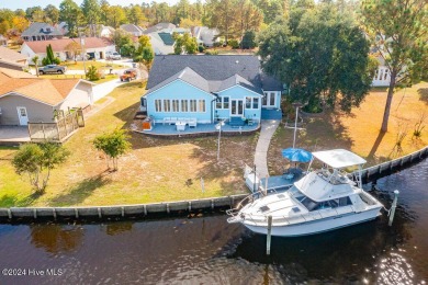 Waterfront resort home with stunning waterfront views! Dock your on Harbour Point Golf Club in North Carolina - for sale on GolfHomes.com, golf home, golf lot