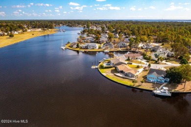 Waterfront resort home with stunning waterfront views! Dock your on Harbour Point Golf Club in North Carolina - for sale on GolfHomes.com, golf home, golf lot