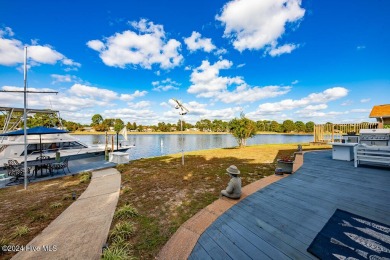 Waterfront resort home with stunning waterfront views! Dock your on Harbour Point Golf Club in North Carolina - for sale on GolfHomes.com, golf home, golf lot