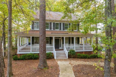 Charming lake access home situated on a unique lot that offers on Reynolds Lake Oconee - The Oconee in Georgia - for sale on GolfHomes.com, golf home, golf lot