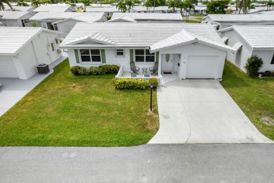 Nestled within 55+ Palm Beach Leisureville, this charming home on Leisureville Community Golf Course in Florida - for sale on GolfHomes.com, golf home, golf lot