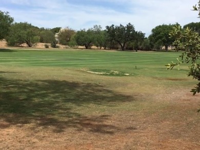 Watch golfers approach the 15th green of Apple Rock Golf Course on Ram Rock Golf Course in Texas - for sale on GolfHomes.com, golf home, golf lot