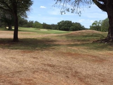 Watch golfers approach the 15th green of Apple Rock Golf Course on Ram Rock Golf Course in Texas - for sale on GolfHomes.com, golf home, golf lot