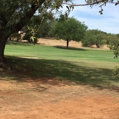 Watch golfers approach the 15th green of Apple Rock Golf Course on Ram Rock Golf Course in Texas - for sale on GolfHomes.com, golf home, golf lot