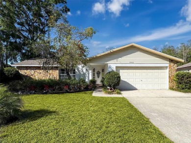 SERENITY AWAITS WITH THIS MOVE-IN READY home with private oasis on Seven Springs Golf and Country Club in Florida - for sale on GolfHomes.com, golf home, golf lot