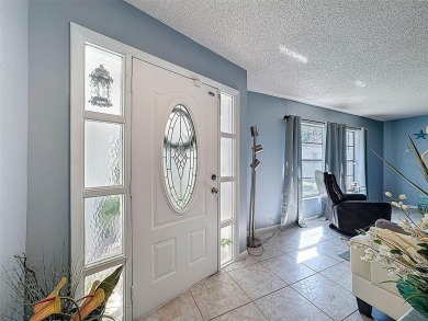 SERENITY AWAITS WITH THIS MOVE-IN READY home with private oasis on Seven Springs Golf and Country Club in Florida - for sale on GolfHomes.com, golf home, golf lot