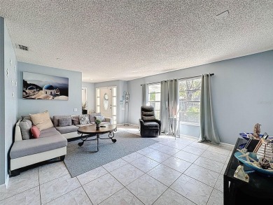 SERENITY AWAITS WITH THIS MOVE-IN READY home with private oasis on Seven Springs Golf and Country Club in Florida - for sale on GolfHomes.com, golf home, golf lot