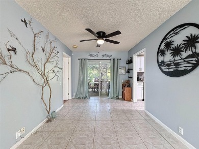 SERENITY AWAITS WITH THIS MOVE-IN READY home with private oasis on Seven Springs Golf and Country Club in Florida - for sale on GolfHomes.com, golf home, golf lot