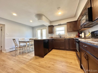 Welcome to this charming ranch home, beautifully updated and on Pine Grove Country Club in Michigan - for sale on GolfHomes.com, golf home, golf lot
