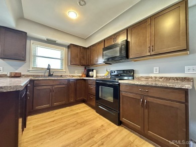 Welcome to this charming ranch home, beautifully updated and on Pine Grove Country Club in Michigan - for sale on GolfHomes.com, golf home, golf lot