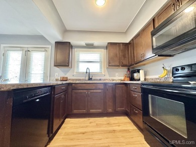 Welcome to this charming ranch home, beautifully updated and on Pine Grove Country Club in Michigan - for sale on GolfHomes.com, golf home, golf lot