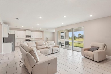 Stunning 4-Bedroom Pond View Home in Gated Star Farms at on Esplanade Golf and Country at Lakewood Ranch in Florida - for sale on GolfHomes.com, golf home, golf lot