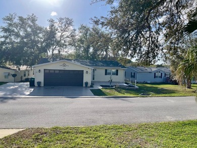 CHECK OUT THIS HOME in the sought after 55+ Gated Community of on Water Oak Country Club Estates in Florida - for sale on GolfHomes.com, golf home, golf lot