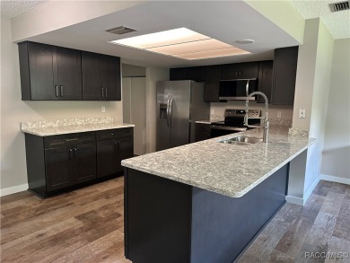 This beautifully remodeled home is right in the HEART of golf on Plantation Inn and Golf Resort  in Florida - for sale on GolfHomes.com, golf home, golf lot