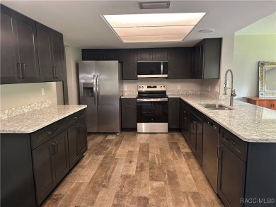 This beautifully remodeled home is right in the HEART of golf on Plantation Inn and Golf Resort  in Florida - for sale on GolfHomes.com, golf home, golf lot