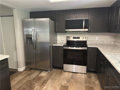 This beautifully remodeled home is right in the HEART of golf on Plantation Inn and Golf Resort  in Florida - for sale on GolfHomes.com, golf home, golf lot