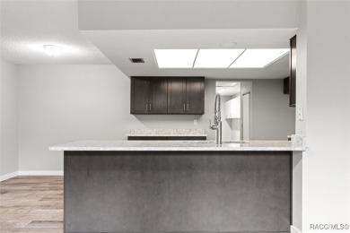 This beautifully remodeled home is right in the HEART of golf on Plantation Inn and Golf Resort  in Florida - for sale on GolfHomes.com, golf home, golf lot