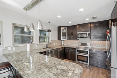 Deep water canal-front home in Gulf Breeze! Boating enthusiasts on Tiger Point Golf and Country Club in Florida - for sale on GolfHomes.com, golf home, golf lot