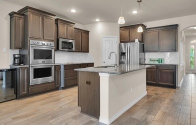 5-bedroom, 3.5-bath home in the popular master-planned community on Twin Rivers Golf Club in Texas - for sale on GolfHomes.com, golf home, golf lot