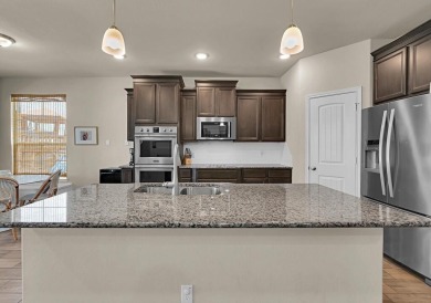 5-bedroom, 3.5-bath home in the popular master-planned community on Twin Rivers Golf Club in Texas - for sale on GolfHomes.com, golf home, golf lot