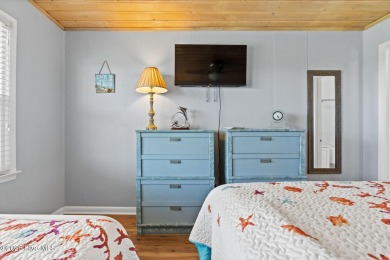 Charming ocean front cottage on the reserved island of Sunset on Oyster Bay Golf Links in North Carolina - for sale on GolfHomes.com, golf home, golf lot