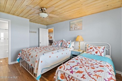 Charming ocean front cottage on the reserved island of Sunset on Oyster Bay Golf Links in North Carolina - for sale on GolfHomes.com, golf home, golf lot
