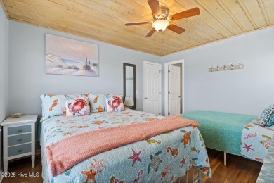 Charming ocean front cottage on the reserved island of Sunset on Oyster Bay Golf Links in North Carolina - for sale on GolfHomes.com, golf home, golf lot