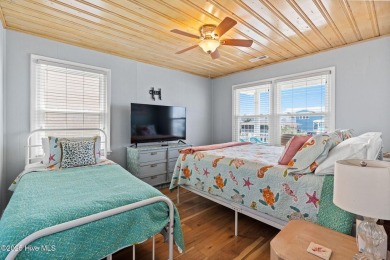 Charming ocean front cottage on the reserved island of Sunset on Oyster Bay Golf Links in North Carolina - for sale on GolfHomes.com, golf home, golf lot