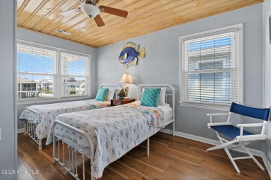 Charming ocean front cottage on the reserved island of Sunset on Oyster Bay Golf Links in North Carolina - for sale on GolfHomes.com, golf home, golf lot