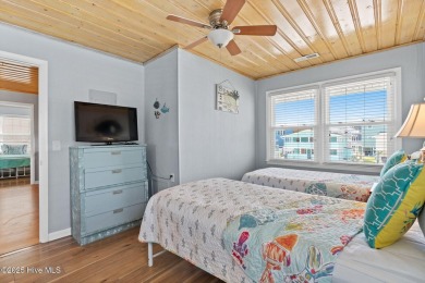 Charming ocean front cottage on the reserved island of Sunset on Oyster Bay Golf Links in North Carolina - for sale on GolfHomes.com, golf home, golf lot