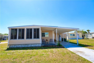 2 bed/2 bath in a cul-de-sac, long driveway w/space for vehicles on Barefoot Bay Golf Course in Florida - for sale on GolfHomes.com, golf home, golf lot