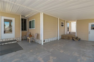 2 bed/2 bath in a cul-de-sac, long driveway w/space for vehicles on Barefoot Bay Golf Course in Florida - for sale on GolfHomes.com, golf home, golf lot