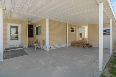 2 bed/2 bath in a cul-de-sac, long driveway w/space for vehicles on Barefoot Bay Golf Course in Florida - for sale on GolfHomes.com, golf home, golf lot