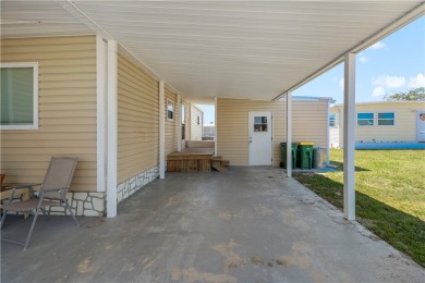 2 bed/2 bath in a cul-de-sac, long driveway w/space for vehicles on Barefoot Bay Golf Course in Florida - for sale on GolfHomes.com, golf home, golf lot
