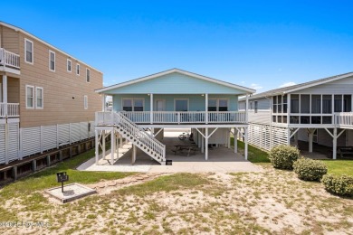 Charming ocean front cottage on the reserved island of Sunset on Oyster Bay Golf Links in North Carolina - for sale on GolfHomes.com, golf home, golf lot