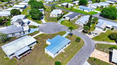 2 bed/2 bath in a cul-de-sac, long driveway w/space for vehicles on Barefoot Bay Golf Course in Florida - for sale on GolfHomes.com, golf home, golf lot