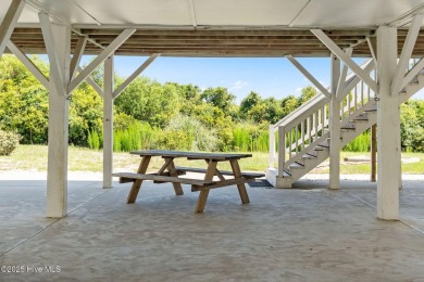 Charming ocean front cottage on the reserved island of Sunset on Oyster Bay Golf Links in North Carolina - for sale on GolfHomes.com, golf home, golf lot