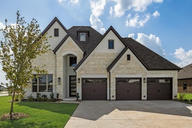 This highly sought-after single-story Altura Aspen floorplan is on Heath Golf and Yacht Club in Texas - for sale on GolfHomes.com, golf home, golf lot