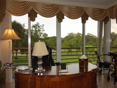 Highly sought-after *King* model with impact windows  accordion on Palm-Aire Country Club and Resort - Palms in Florida - for sale on GolfHomes.com, golf home, golf lot