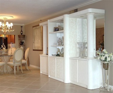 Highly sought-after *King* model with impact windows  accordion on Palm-Aire Country Club and Resort - Palms in Florida - for sale on GolfHomes.com, golf home, golf lot