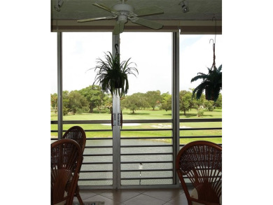 Highly sought-after *King* model with impact windows  accordion on Palm-Aire Country Club and Resort - Palms in Florida - for sale on GolfHomes.com, golf home, golf lot