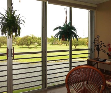Highly sought-after *King* model with impact windows  accordion on Palm-Aire Country Club and Resort - Palms in Florida - for sale on GolfHomes.com, golf home, golf lot