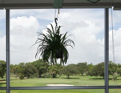 Highly sought-after *King* model with impact windows  accordion on Palm-Aire Country Club and Resort - Palms in Florida - for sale on GolfHomes.com, golf home, golf lot