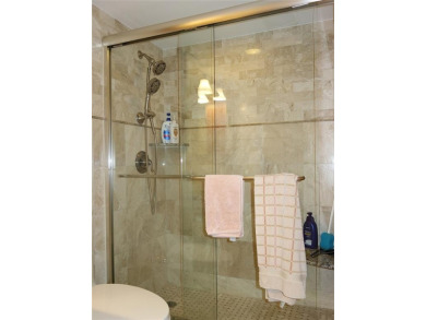 Highly sought-after *King* model with impact windows  accordion on Palm-Aire Country Club and Resort - Palms in Florida - for sale on GolfHomes.com, golf home, golf lot
