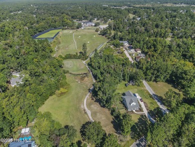 You don't want to miss this 5 bedroom, 3.5 bathroom Coastal on Belvedere Country Club in North Carolina - for sale on GolfHomes.com, golf home, golf lot