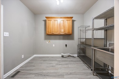 Welcome home to your single level, exceptionally built residence on Hampton Cove Golf Course in AL - for sale on GolfHomes.com, golf home, golf lot