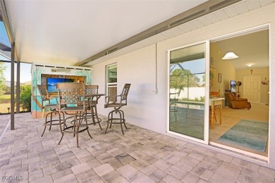 Pool Home Near Coral Oaks Golf Course featuring a great room on Burnt Store Golf Club in Florida - for sale on GolfHomes.com, golf home, golf lot